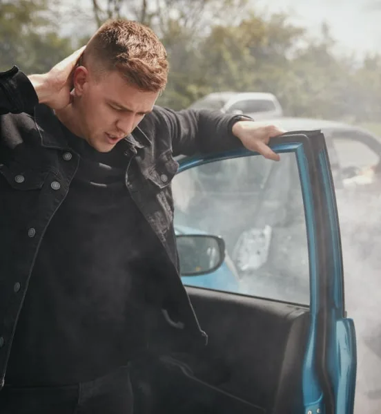 Man Stepping Out Of His Car After A Car Accident