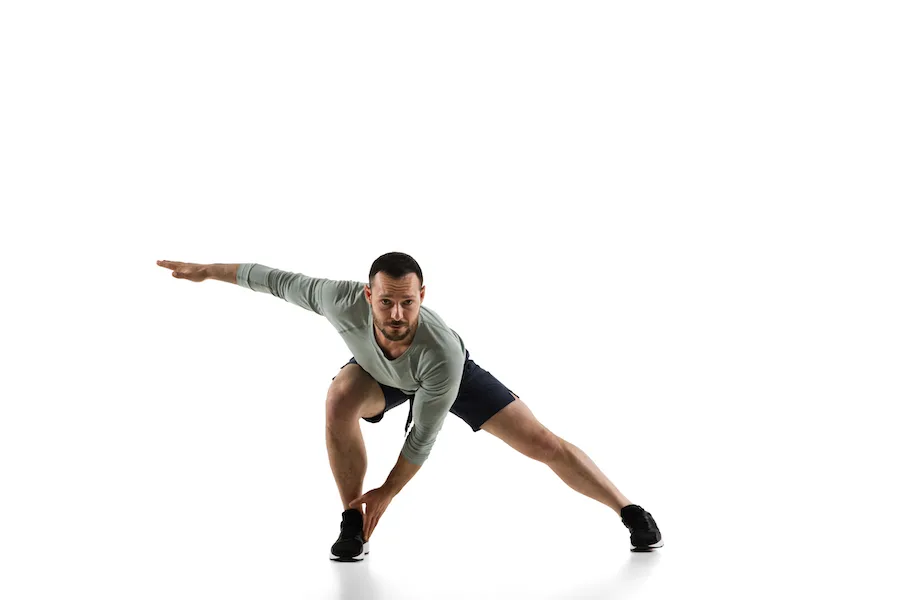 A Person Doing Stretches On A White Background